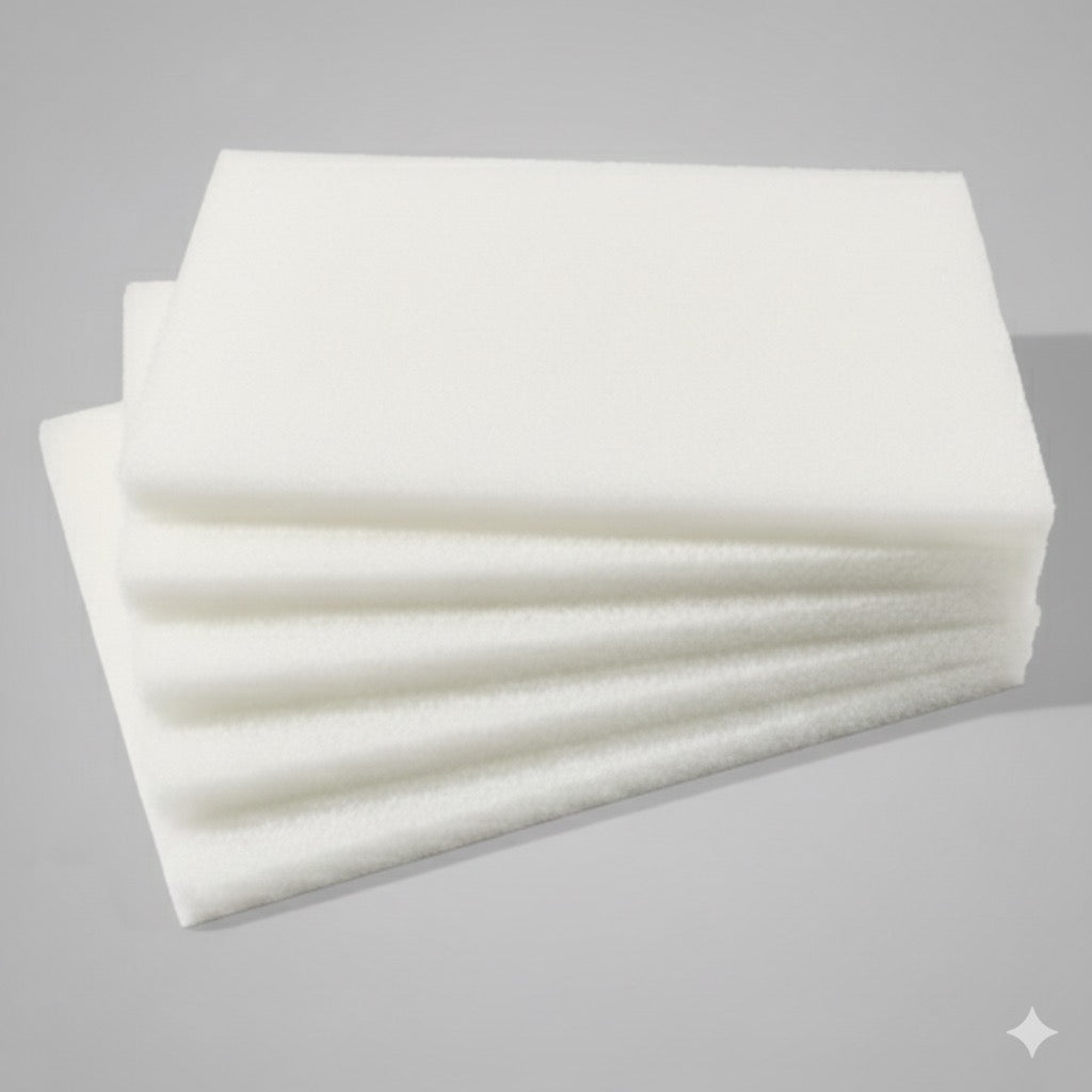 Stack of white scrubbing pads on a gray background